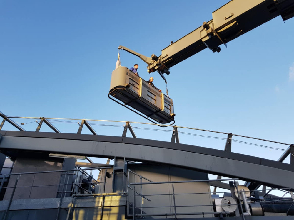 bmu cage on the top of moorehouse building uk