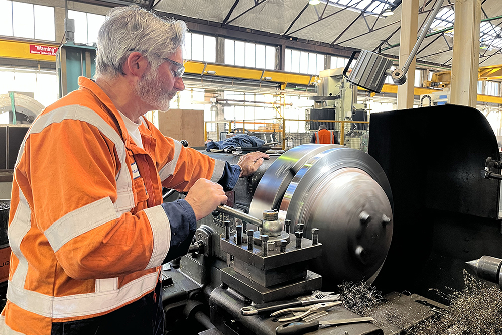 Machinst on lathe Tile