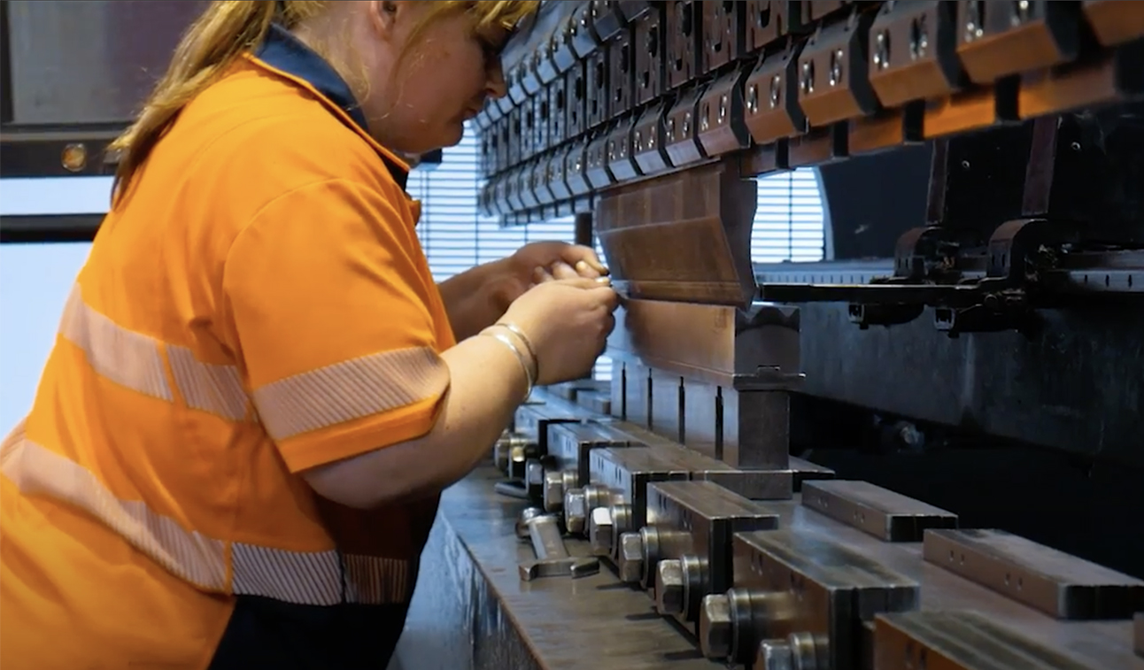 Brake Press Operator Theresa folding Sheetmetal Parts on the Brakepress