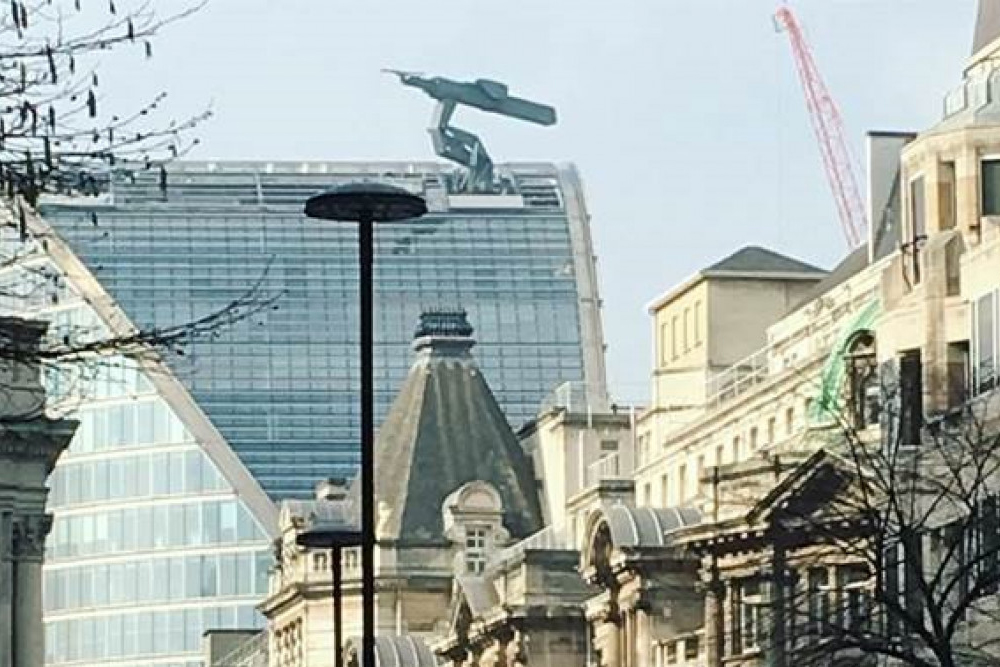 BMU on the curved glass tower on Moorhouse Ave above roofline tile